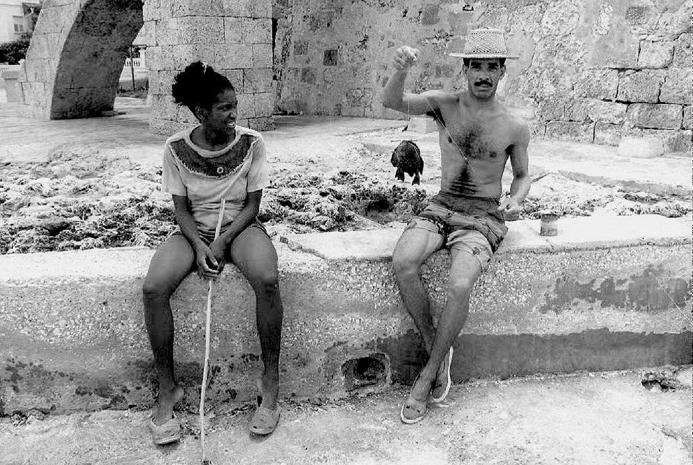 1993 - A fisherman and his wife sell their latest catch of fish. Previously, the pair had only fished for pleasure but an eco