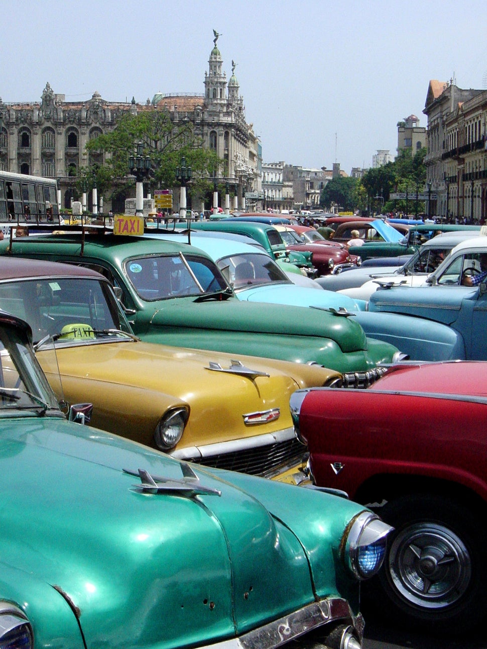 2003 - Several earlier model American-made cars wait to be rented in Havana. New car imports have been allowed in Cuba since 