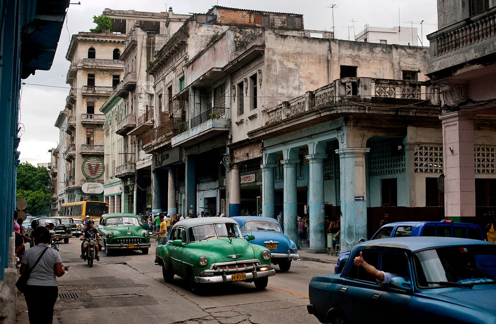 2012 - Cars drive down a street in Havana.