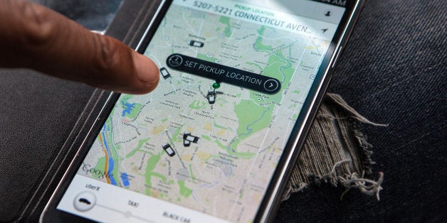 WASHINGTON, DC - APR 4: UberX driver, Michael Belet, checks the Uber customer app to see where other Uber drivers are working so he can determine where the best place for him to get fares might be, April 7, 2014, in Washington, DC. Thousands of local car owners have signed up in recent months to drive with one of the 'ride-share' operators that use smartphone apps to link people needing rides with car owners willing to give them, for a price. (Photo by Evelyn Hockstein/For The Washington Post via Getty Images)