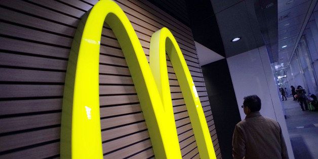 A logo of McDonald's is seen at its restaurant in Tokyo, Wednesday, Dec. 17, 2014. McDonald's in Japan has begun limiting the serving size of fries as stocks of spuds run short due to labor disruptions on the U.S. West Coast. (AP Photo/Eugene Hoshiko)