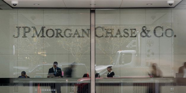 Employees work in the lobby of JPMorgan Chase & Co. headquarters in New York, U.S., on Monday, Dec. 8, 2014. U.S. stocks dropped, following the worst loss in six weeks for the Standard & Poor's 500 Index, as global shares slid on concern over growth in China and potential political turmoil in Greece. Photographer: Ron Antonelli/Bloomberg via Getty Images