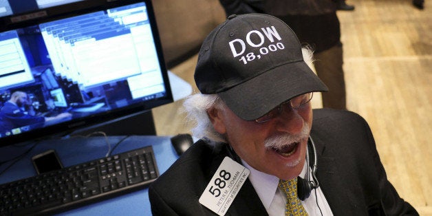 Peter Tuchman wears a "DOW 18,000" hat on the floor at the New York Stock Exchange in New York, Tuesday, Dec. 23, 2014. U.S.