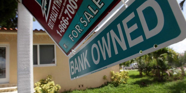 MIAMI - SEPTEMBER 16: A Bank Owned sign is seen in front of a foreclosed home on September 16, 2010 in Miami, Florida. RealtyTrac, an online marketplace for foreclosure properties, released its U.S. Foreclosure Market Report for August 2010, which shows foreclosure filings - default notices, scheduled auctions and bank repossessions - were reported on 338,836 properties in August, a 4 percent increase from the previous month. (Photo by Joe Raedle/Getty Images)