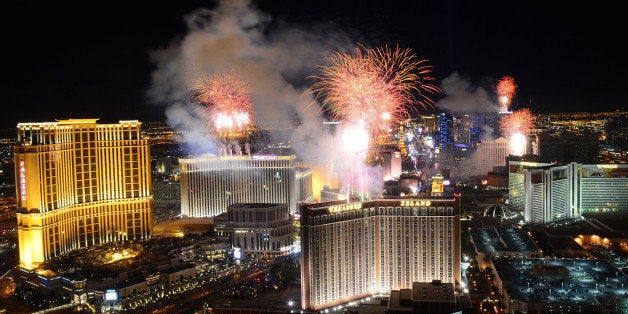 In this photo provided by the Las Vegas News Bureau, fireworks burst over the Las Vegas Strip at midnight on New Year's 2014,