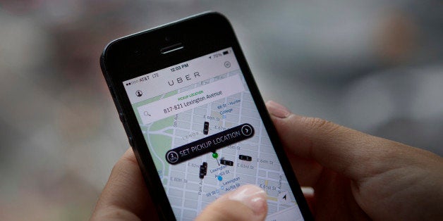 Th Uber Technologies Inc. car service application (app) is demonstrated for a photograph on an Apple Inc. iPhone in New York, U.S., on Wednesday, Aug. 6, 2014. For San Francisco-based Uber Technologies Inc. which recently raised $1.2 billion of investors' financing at $17 billion valuation, New York is its biggest by revenue among the 150 cities in which it operates across 42 countries. The Hamptons are a pop-up market for high-end season weekends where the average trip is three time that of an average trip in New York City. Photographer: Victor J. Blue/Bloomberg via Getty Images