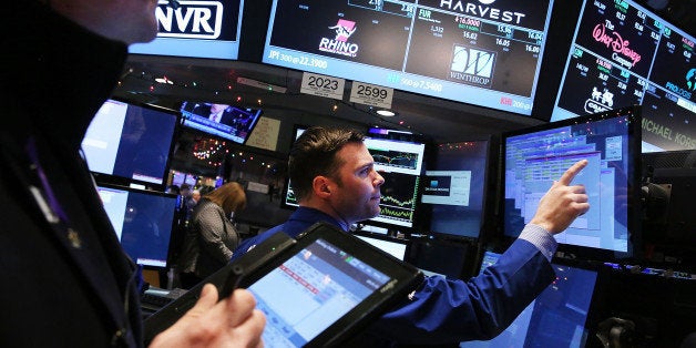 NEW YORK, NY - JANUARY 06: Traders work on the floor of the New York Stock Exchange (NYSE) on January 6, 2015 in New York City. Stocks were up slightly in morning trading following a steep decline yesterday partly on fears of a continued fall in global oil prices (Photo by Spencer Platt/Getty Images)