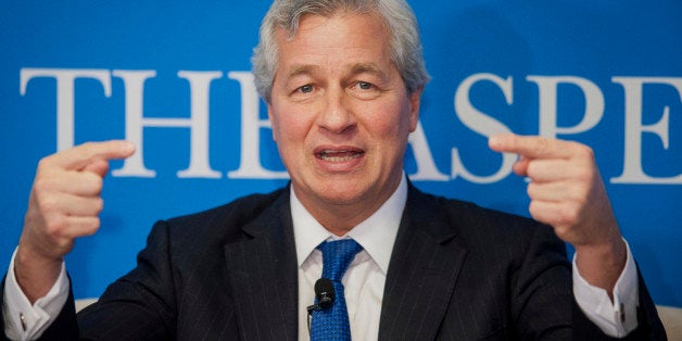 Jamie Dimon, chairman, president and chief executive officer of JPMorgan Chase & Co., speaks during an Aspen Institute event in Washington, D.C., U.S., on Thursday, Dec. 12, 2013. Dimon said banks will have to charge more for lending to get a 'fair return' as regulators require the industry to set aside more funds to cushion against losses. Photographer: Pete Marovich/Bloomberg via Getty Images *** Local Caption *** Jamie Dimon