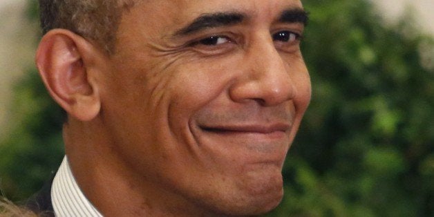 US President Barack Obama smiles at as he awards the Medal of Honor to Army First Lieutenant Alonzo Cushing, given to relative Helen Loring Ensign, 85, of Palm Desert, California for conspicuous gallantry at the White House in Washington, DC on November 6, 2014. Cushing awarded posthumously for his actions while serving as commanding officer of Battery A, 4th United States Artillery, Artillery Brigade, 2nd Corps, Army of the Potomac during combat operations in the vicinity of Cemetery Ridge, Gettysburg, Pennsylvania, on July 3, 1863. AFP PHOTO/YURI GRIPAS (Photo credit should read YURI GRIPAS/AFP/Getty Images)