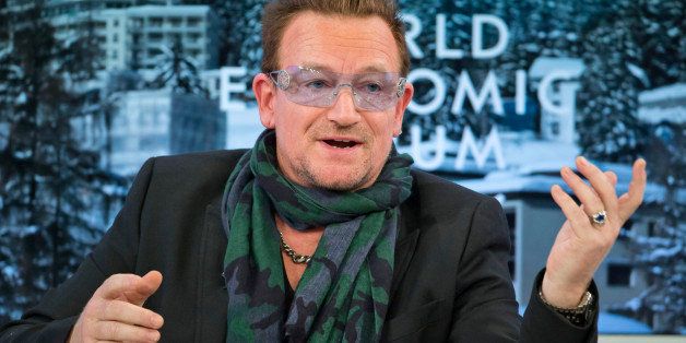 Rock star Bono speaks during a panel discussion "The Post-2015 Goals: Inspiring a New Generation to Act", the fifth annual Associated Press debate, at the World Economic Forum in Davos, Switzerland, Friday, Jan. 24, 2014. (AP Photo/Michel Euler)