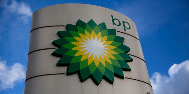 A BP logo is seen outside a petrol station in the town of Bletchley in Buckinghamshire, England, Thursday, Jan. 15, 2015. BP
