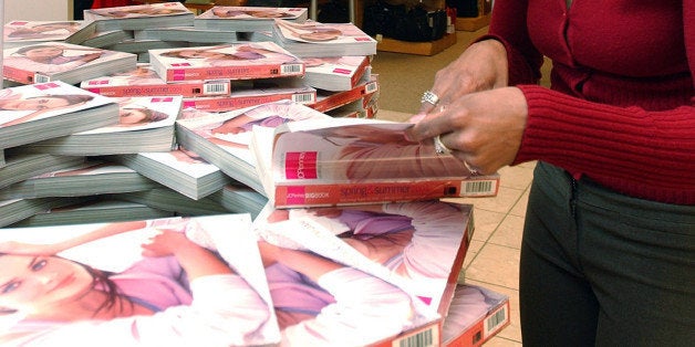 UNITED STATES - FEBRUARY 26: Kara Anderson of Peabody, Massachusetts looks through 'The Big Book' JC Penny catalog at a store in Peabody, Massachusetts on Thursday February 26, 2004. J.C. Penney Co., the No. 2 U.S. department store, had a fourth-quarter loss of $1.07 billion after writing down the value of its Eckerd drugstore chain. J.C. Penney's department store and catalog sales rose the most in seven years as shoppers bought more jewelry and other gifts. (Photo by Neal Hamberg/Bloomberg via Getty Images)