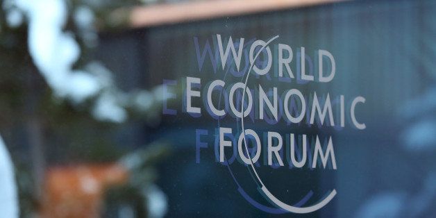 A logo sits on a glass panel inside the Kongress Zentrum, also known as Congress Center, the venue of the World Economic Forum (WEF) in Davos, Switzerland, on Monday, Jan. 19, 2015. This week World leaders, influential executives, bankers and policy makers will attend the 45th annual meeting of the World Economic Forum in Davos that runs from Jan. 21-24. Photographer: Chris Ratcliffe/Bloomberg via Getty Images