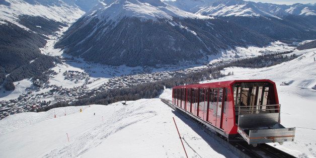 A cable train makes its way up the Weissfluhjoch mountain in Davos, Switzerland, Monday, Jan. 19, 2015. The world's financial and political elite will head this week to the Swiss Alps for 2015's gathering of the World Economic Forum , WEF, at the Swiss ski resort of Davos. (AP Photo/Michel Euler)