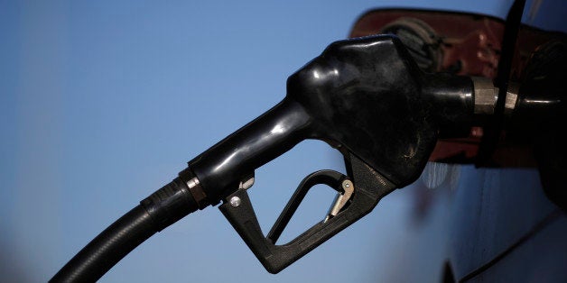 A gasoline nozzle is inserted into a vehicle's gas tank during refueling at a a Royal Dutch Shell Plc gas station in Portland