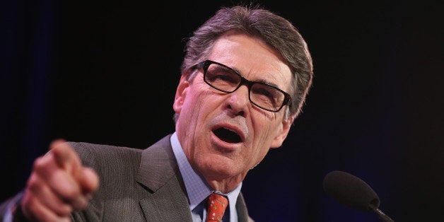 DES MOINES, IA - JANUARY 24: Former Texas Governor Rick Perry speaks to guests at the Iowa Freedom Summit on January 24, 2015 in Des Moines, Iowa. The summit is hosting a group of potential 2016 Republican presidential candidates to discuss core conservative principles ahead of the January 2016 Iowa Caucuses. (Photo by Scott Olson/Getty Images)