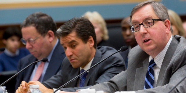 Matthew Polka, president and chief executive officer of the American Cable Association, right, speaks during a House Judiciary Subcommittee hearing with Robert Marcus, chairman and chief executive officer of Time Warner Cable Inc., center, and David Cohen, executive vice president of Comcast Corp., in Washington, D.C., U.S., on Thursday, May 8, 2014. The Justice Department and Federal Communications Commission (FCC) are considering Comcast's $45.2 billion proposal in February to acquire Time Warner Cable. The deal would combine the two largest U.S. cable companies and give the enlarged Comcast about 30 million subscribers. Photographer: Andrew Harrer/Bloomberg via Getty Images 