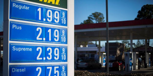 In this Sunday, Jan. 25, 2015 photo, a gas station advertises their prices for passing motorists in Atlanta. (AP Photo/David Goldman)