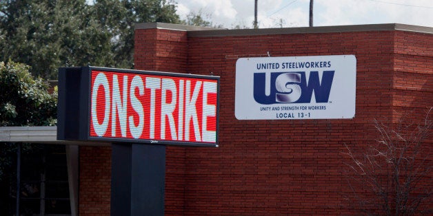 A sign reading 'On Strike' is seen outside of the United Steelworkers (USW) offices in Texas City, Texas, U.S., on Monday, Feb. 2, 2015. One U.S. refinery is shutting while management takes control of operations at six others after union workers walked out of the plants in the biggest strike since 1980. Photographer: F. Carter Smith/Bloomberg via Getty Images