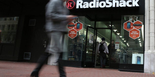 SAN FRANCISCO, CA - MARCH 04: A person walks by a Radio Shack store on March 4, 2014 in San Francisco, California. RadioShack announced plans to close over 1,000 of its underperforming stores, approximately 20 percent of its retail locations, as part of a restructuring to be more competitive in retail electronics. (Photo by Justin Sullivan/Getty Images)