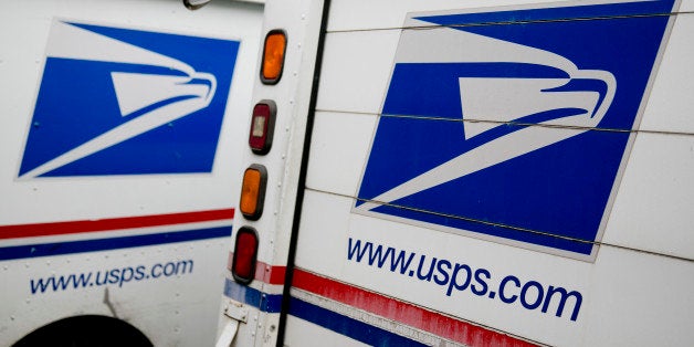 U.S. Postal Service delivery trucks sit at the Brookland Post Office in Washington, D.C., U.S., on Thursday,...