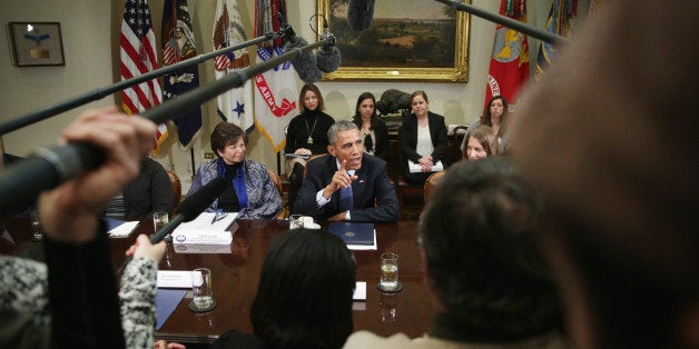 WASHINGTON, DC - FEBRUARY 03: U.S. President Barack Obama (C) speaks as Secretary of Health and Human Services Sylvia Burwell (R) and White House senior adviser Valerie Jarrett (L) look on during a meeting with citizens who wrote letters to him about Affordable Care Act February 3, 2015 in the Roosevelt Room of the White House in Washington, DC. President Obama discussed the benefits of the Affordable Care Act during the meeting. (Photo by Alex Wong/Getty Images)