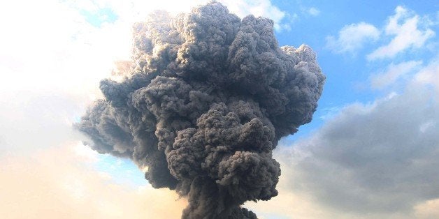 SUMATRA, INDONESIA - OCTOBER 13: Mount Sinabung spews pyroclastic smoke, seen from Tiga Pancur village in Karo district of N