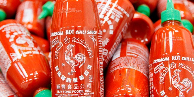 FILE - In this Tuesday, Oct 29, 2013, file photo, Sriracha chili sauce bottles are produced at the Huy Fong Foods factory in