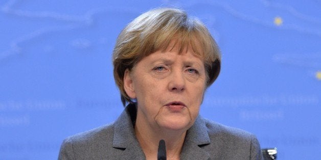 BRUSSELS, BELGIUM - FEBRUARY 12: German Chancellor Angela Merkel speaks during a press conference after the European Union Leaders Summit at the European Council headquarters in Brussels, Belgium, on February 12, 2015. (Photo by Dursun Aydemir/Anadolu Agency/Getty Images)