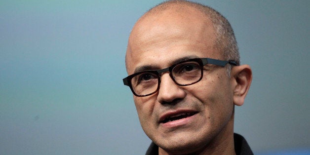 FILE- In this May 20, 2014 file photo, Satya Nadella, CEO of Microsoft, talks during the introduction the Surface Pro 3 tablet device at a media preview in New York. Microsoft on Thursday, July 17, 2014 announced it will lay off up to 18,000 workers over the next year. (AP Photo/Mark Lennihan, File)