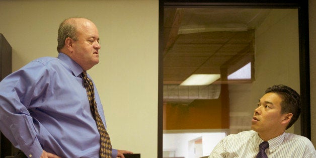 Two businessmen talking in office