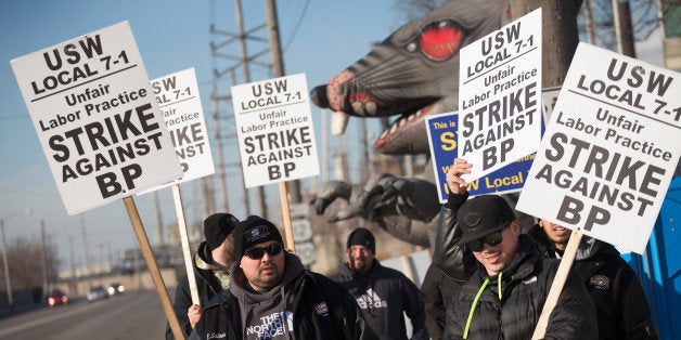 WHITING, IN - FEBRUARY 10: Members of the United Steelworkers Union and other supporting unions picket outside the BP refinery on February 10, 2015 in Whiting, Indiana. Workers at the BP refinery walked off the job Sunday morning after failing to reach an agreement on a new contract. They join workers at nine other oil refineries and plants in the first nationwide refinery strike since 1980. (Photo by Scott Olson/Getty Images)