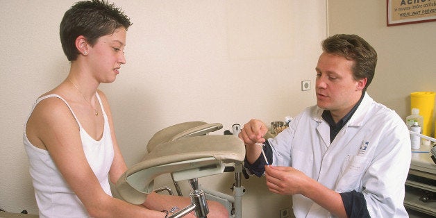 Model And Doctor. Gynecologist. Inserting Iud. (Photo By BSIP/UIG Via Getty Images)