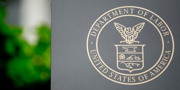 The U.S. Department of Labor seal is seen on a sign outside of the headquarters in Washington, D.C., U.S., on Wednesday, July