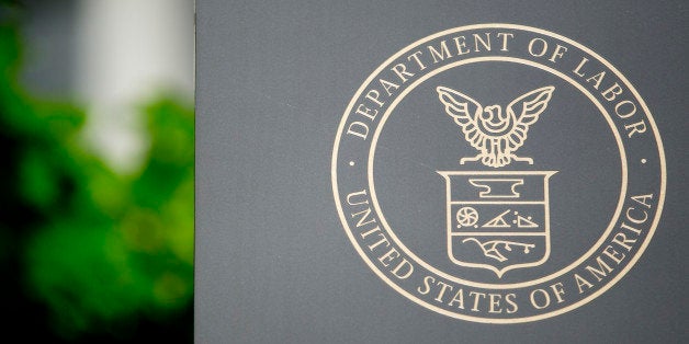 The U.S. Department of Labor seal is seen on a sign outside of the headquarters in Washington, D.C., U.S., on Wednesday, July 3, 2013. The U.S. Department of Labor is scheduled to release unemployment rate figures on Friday, July 5. Photographer: Andrew Harrer/Bloomberg via Getty Images