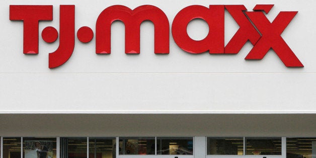 FILE - In this Aug. 16, 2010 file photo, shoppers enter and exit a TJ Maxx store in Barre, Vt. TJX Companies Inc., parent of