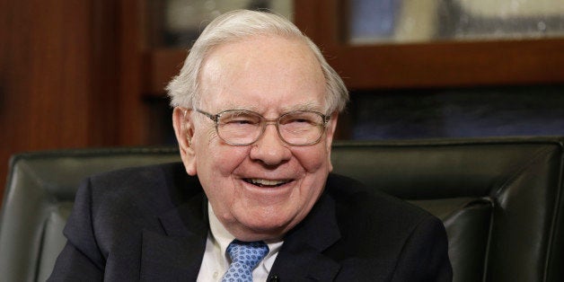 Berkshire Hathaway Chairman and CEO Warren Buffett laughs during an interview with Liz Claman on the Fox Business Network in Omaha, Neb., Monday, May 5, 2014. The annual Berkshire Hathaway shareholders meeting concluded over the weekend. (AP Photo/Nati Harnik)