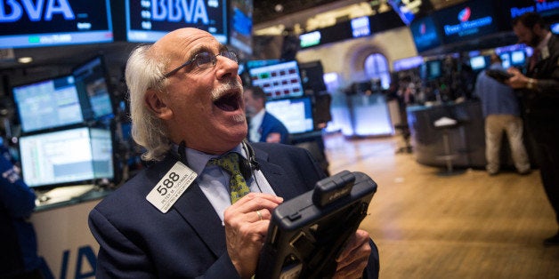 NEW YORK, NY - FEBRUARY 13: A trader works on the floor of the New York Stock Exchange during the afternoon of February 13, 2015 in New York City. The Dow Jones Industrial Average closed above 18,000 points for the first time in market history. (Photo by Andrew Burton/Getty Images)