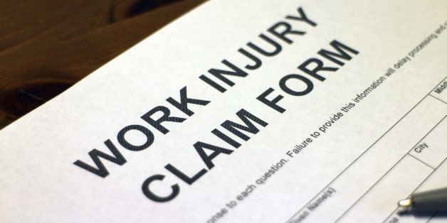 Someone filling out Work Injury Claim Form
