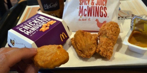 Chicken made products, Chicken McNuggets (L) and McWings are displayed at a McDonald's restaurant in Tokyo on July 25, 2014. McDonald's Japan said all of its Japanese restaurants had stopped selling products made with chicken from China, in the wake of a scandal that saw expired meat sold to fast food giants. More than 3,000 restaurants across Japan had also halted imports of chicken products from the country, the chain said, adding that it had switched to distributors in Thailand 'to address the concerns of our customers'. AFP PHOTO / Yoshikazu TSUNO (Photo credit should read YOSHIKAZU TSUNO/AFP/Getty Images)