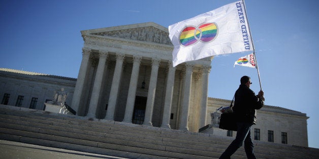 WASHINGTON, DC - JANUARY 09: Pete Prete of Equality Beyond Gender holds a 'marriage pride flag' outside the U.S. Supreme Court January 9, 2015 in Washington, DC. The justices of the Supreme Court were scheduled to meet to determine whether the court will take up any of the five pending state-banned same-sex marriage cases in Ohio, Tennessee, Michigan, Kentucky and Louisiana. (Photo by Alex Wong/Getty Images)