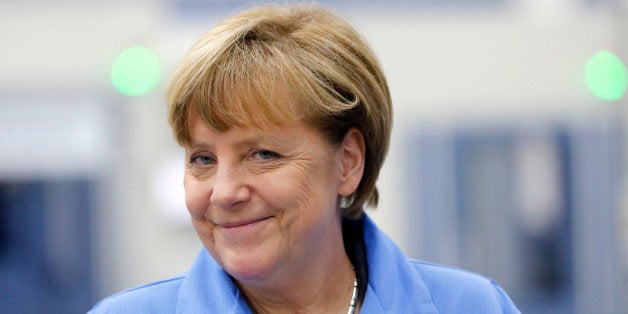 German Chancellor Angela Merkel smiles during her visit to the Siemens electronics manufacturing plant in Amberg, Germany, Mo