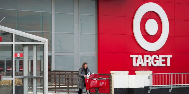 Shopper Laura Steele pushes a shopping cart as she leaves a Target Corp. store in Toronto, Ontario, Canada, on Thursday, Jan.