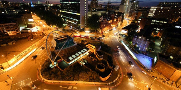 Street lighting illuminates traffic as it moves around the Old Street roundabout, also referred to as 'Silicon Roundabout,' in the area known as 'Tech City' in London, U.K., on Wednesday, Aug. 20, 2014. Brookfield Asset Management Inc. is close to an agreement for Amazon.com Inc. to rent about 400,000 square feet (37,160 square meters) of office space near the London technology hub known as Silicon Roundabout, a person with knowledge of the talks said last month. Photographer: Chris Ratcliffe/Bloomberg via Getty Images