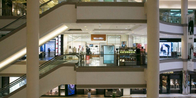 BANGKOK, THAILAND - FEBRUARY 4: A person wewalks through a near empty shopping mall at a protest site February 4, 2014 in do