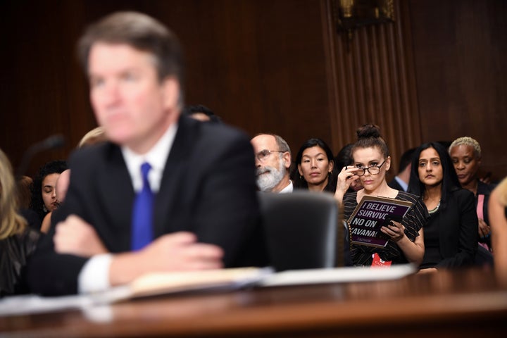 Actress Alyssa Milano listens to Supreme Court nominee Brett Kavanaugh as he testifies before the Senate Judiciary Committee