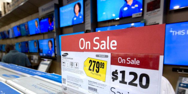 FILE - In this Friday, Nov. 29, 2013, file photo TV sets, are on sale in the Pembroke Pines, Fla. Best Buy store. As stores clear out older merchandise and new models get introduced, good deals abound if you want a big new TV for the Super Bowl or video games. (AP Photo/J Pat Carter, File)