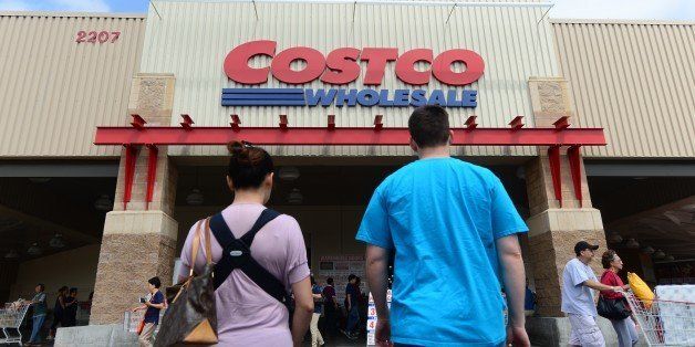 A couple make their way toward the entrance of a Costco store in Alhambra, California on June 2, 2013. Costco stores have been linked to a multi-state outbreak of hepatitis A infections with at least 30 cases nationwide may be linked to an organic antioxidant blend of frozen berries from Townsend Farms, with seven confirmed illnesses in California. The product has been removed from the shelves of Costco stores and customers who bought the product are being notified. AFP PHOTO/Federic J. BROWN (Photo credit should read FREDERIC J. BROWN/AFP/Getty Images)