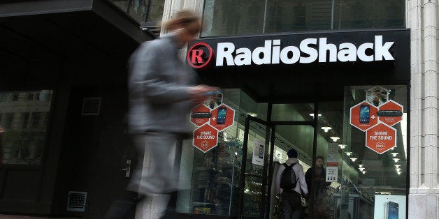 SAN FRANCISCO, CA - MARCH 04: A person walks by a Radio Shack store on March 4, 2014 in San Francisco, California. RadioShack announced plans to close over 1,000 of its underperforming stores, approximately 20 percent of its retail locations, as part of a restructuring to be more competitive in retail electronics. (Photo by Justin Sullivan/Getty Images)