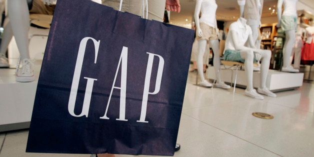 FILE - In this May 27, 2007 file photo, a customer shops at a Gap store in Palo Alto, Calif. Gap is taking a lot of flak online for stealthily swapping out its decades-old white-on-navy blue logo. (AP Photo/Paul Sakuma, File)